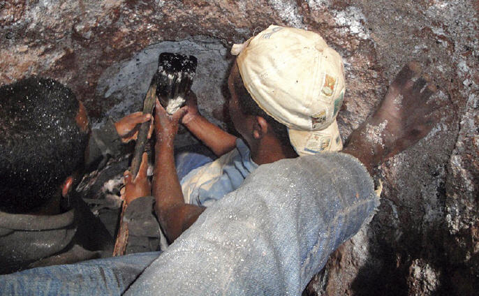 Unique photo of miners inside the workings in Estatoby extracting one of the world’s finest crystals of liddicoatite. G. Rakotonirina photo.
